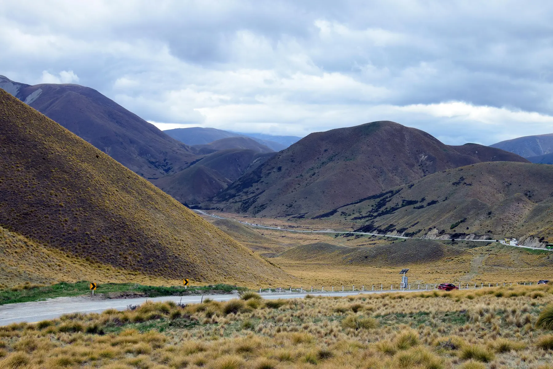 New Zealand landscape with a highway through hills, representing regional freight routes
